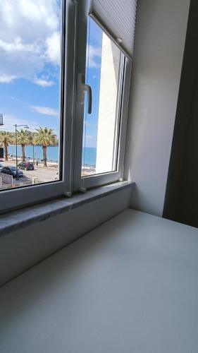 Ένα ή περισσότερα κρεβάτια σε δωμάτιο στο B & Beach