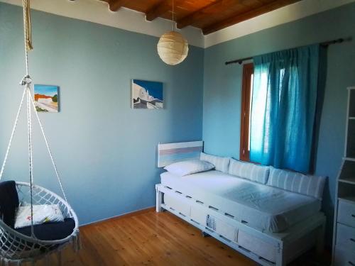 Postel nebo postele na pokoji v ubytování Cycladic House