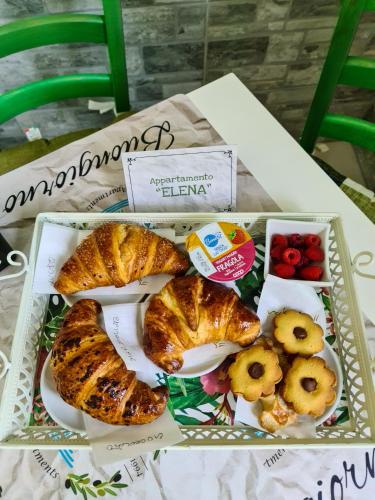 a tray of food with pastries and fruit on a table at Agriturismo le Fontane - Lago di Bolsena in Grotte di Castro