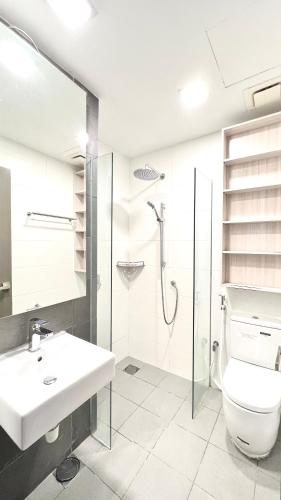 a bathroom with a sink and a toilet and a shower at Suasana Lifestyle Suites by Keystone in Johor Bahru