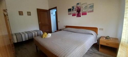 Postel nebo postele na pokoji v ubytování -Casina Vitty-