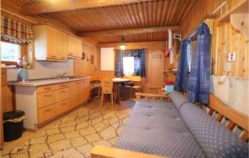 a kitchen with a couch in the middle of a room at Amazing Home In Vordernberg With House A Mountain View in Vordernberg