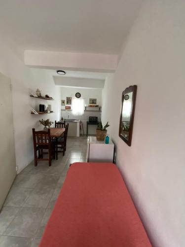 a red carpet in a living room with a table at La Escala in Corrientes