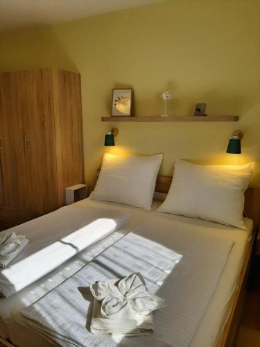 Posteľ alebo postele v izbe v ubytovaní Bodzafa Apartman