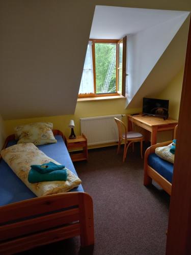 Postel nebo postele na pokoji v ubytování Hotel Nové Údolí