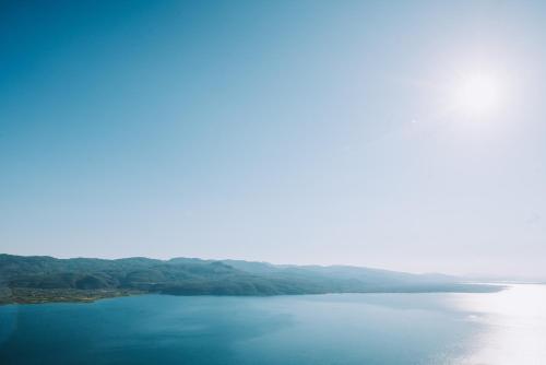 a view of a large body of water at Althaia Hotel in Thermo