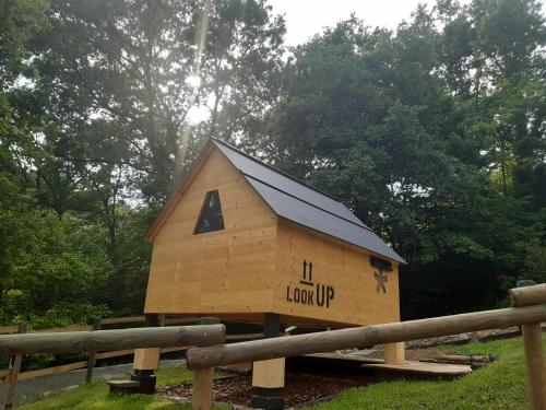 a building with a roof on top of a fence at Starsbox Le Moline B&B in Masserano