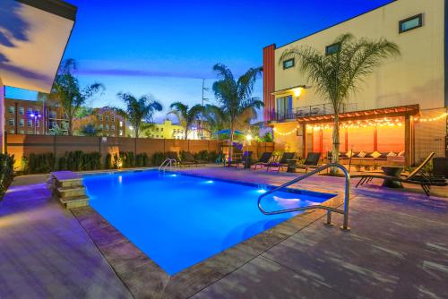 a large swimming pool with blue lighting in a building at Private Townhouse in a Secure Location in New Orleans