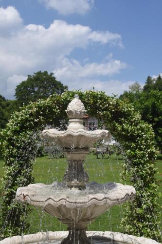a fountain in the middle of a park at Casale al Foino in Induno Olona