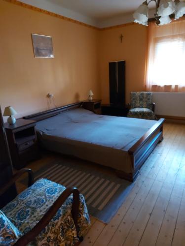 Postel nebo postele na pokoji v ubytování Manó Vendégház