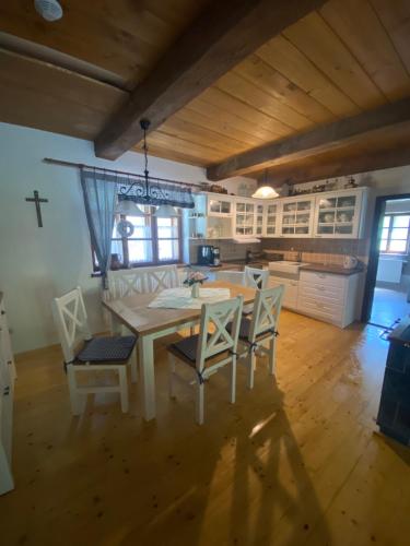 a kitchen with a table and chairs in a room at Chalupa Svojanov in Svojanov