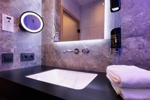 a bathroom with a sink and a mirror at Am Paulusbogen in Passau