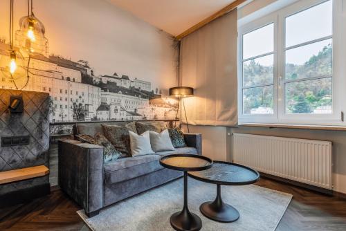 a living room with a couch and a table at Am Paulusbogen in Passau