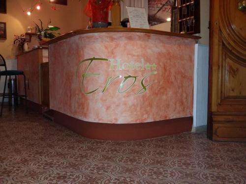 a sign that says hollywood fires on a wall at Hotel Eros in Lido di Camaiore