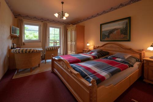 a bedroom with a bed with a wooden frame at Stinglhof in Železná Ruda