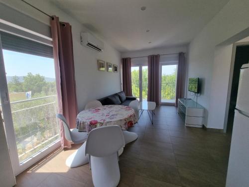 Postel nebo postele na pokoji v ubytování Apartmani Jozic