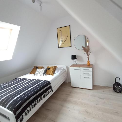 Postel nebo postele na pokoji v ubytování Apartament Pod Bzem Puck
