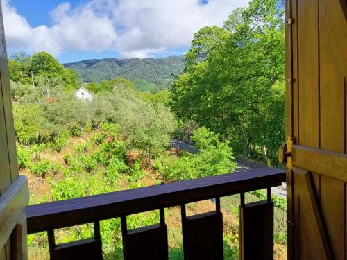 a balcony with a view of the mountains at Quinta de Leandres in Manteigas