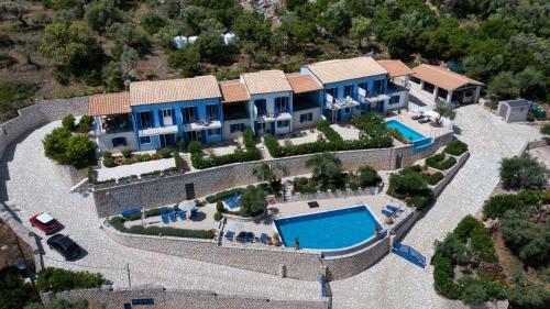 an aerial view of a house with a swimming pool at Villas Amantea- four villas with big pool and infinity pool in Sivota