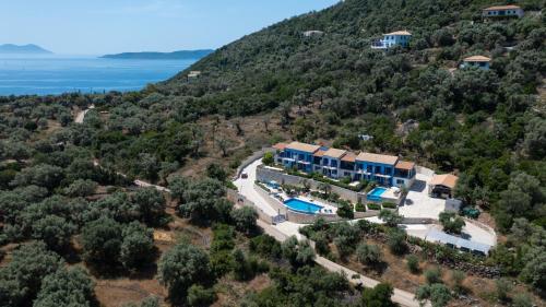 an aerial view of a house on a hill at Villas Amantea- four villas with big pool and infinity pool in Sivota