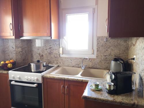 A kitchen or kitchenette at Casa Plumeria at Gouves Beach