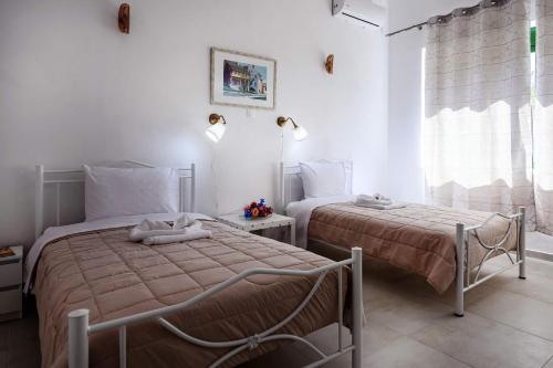 Postel nebo postele na pokoji v ubytování Kornilias home
