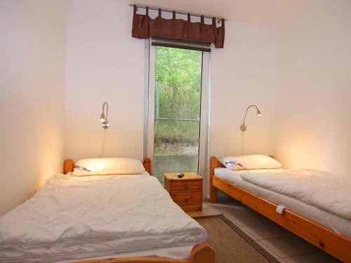 En eller flere senge i et værelse på Ferienwohnung Strandidyll, Trassenheide