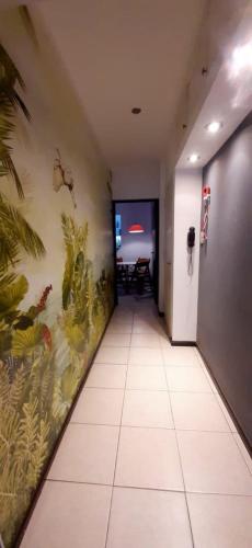 a hallway with a wall with plants on it at Emilio Civit in Mendoza