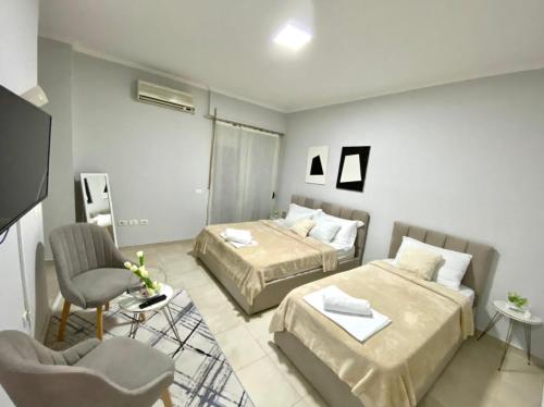 Postel nebo postele na pokoji v ubytování Chlo apartment 1 Tirane