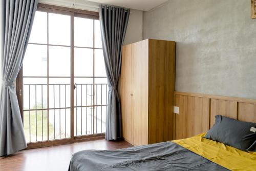 Posteľ alebo postele v izbe v ubytovaní Natsu No Hanabi Villa & Apartment