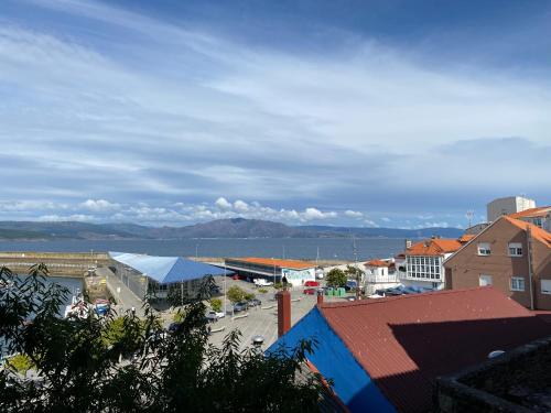 a city with a view of the water and buildings at Casa Real 43 in Finisterre