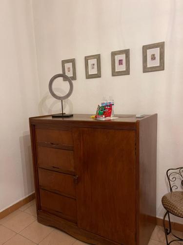 a dresser with a mirror on top of it at Casa Praxedis in Santiago