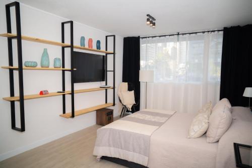 Cama o camas de una habitación en Royal Santiago Apartments