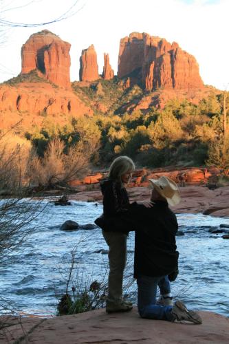 a man and a woman standing next to a river at Cathedral Casita at Sedona Cathedral Hideaway LLC in Sedona