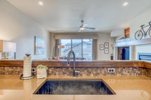 a kitchen with a sink and a window at Deschutes Landing at the Old Mill Riverfront in Bend