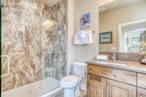 a bathroom with a shower and a toilet and a sink at Deschutes Landing at the Old Mill Riverfront - Meredith Lodging in Bend