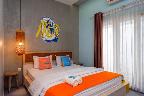 Ένα ή περισσότερα κρεβάτια σε δωμάτιο στο Sans Hotel Absari Yogyakarta