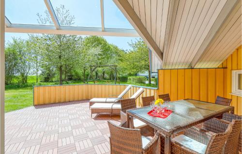 an outdoor patio with a table and chairs at Poolhaus 1 In Hohendorf in Hohendorf