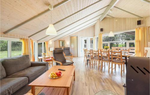 a living room with a couch and a table at Poolhaus 1 In Hohendorf in Hohendorf