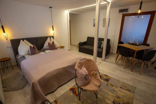 Katil atau katil-katil dalam bilik di Szőcs-birtok Apartments