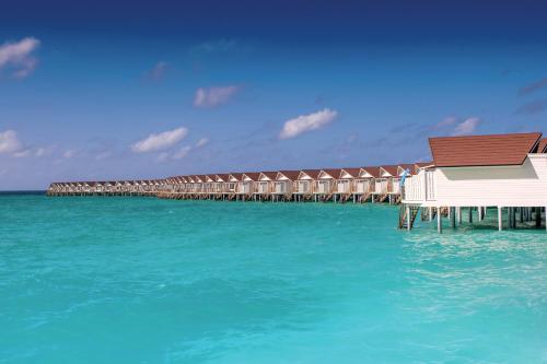 a building on a pier in the water at OBLU XPERIENCE Ailafushi - All Inclusive with Free Transfers in Male City