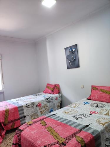 Ένα ή περισσότερα κρεβάτια σε δωμάτιο στο LUCERO APARTAMENTO