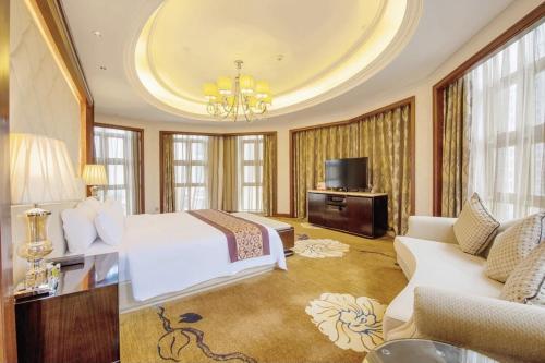 Televisyen dan/atau pusat hiburan di Days Hotel by Wyndham Logan City Huizhou