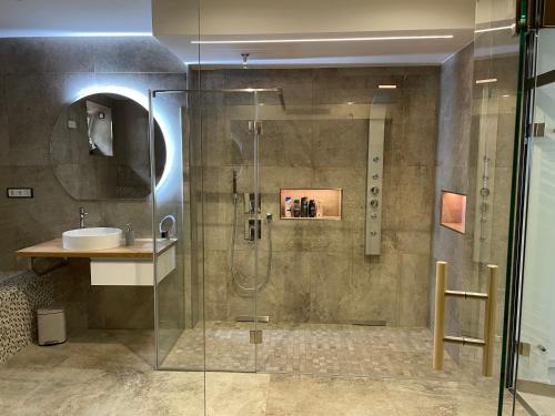 a bathroom with a shower and a sink at Ferienwohnung Silberzeit in Annaberg-Buchholz