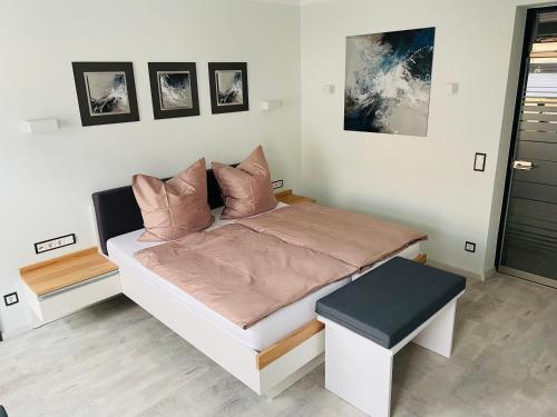 מיטה או מיטות בחדר ב-Ferienwohnung Silberzeit