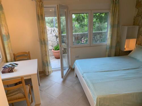 Ένα ή περισσότερα κρεβάτια σε δωμάτιο στο Apartments Mirian