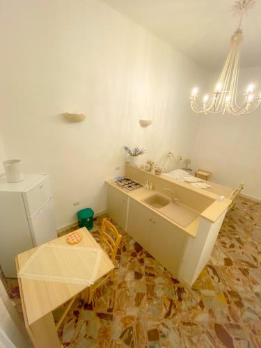 a kitchen with a sink and a counter at La Casa di Nonna Sisina in Mola di Bari