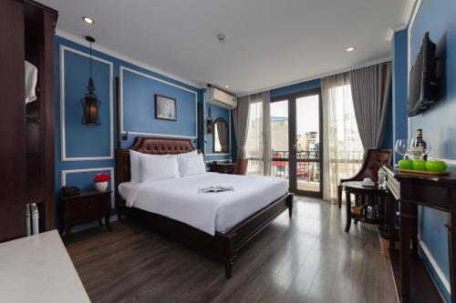 Ένα ή περισσότερα κρεβάτια σε δωμάτιο στο Suddha Boutique Hotel