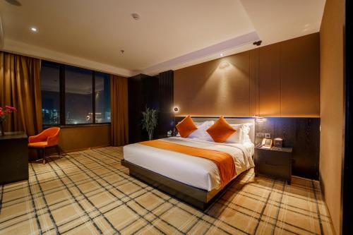 a hotel room with a bed and a window at OCEAN HOTEL in Phnom Penh
