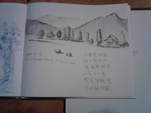 a book with a drawing of a house and mountains at Apartmenthaus Hinterer in Bad Goisern
